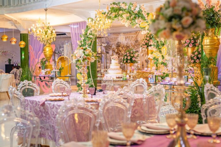 Lavishly decorated quinceañera venue with elegant floral arrangements and chandeliers.