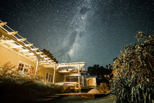 Stunning night landscape of a rural house under the Milky Way in Kerikeri, New Zealand.