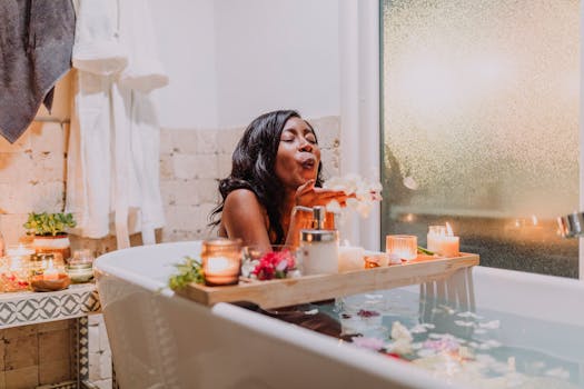 A serene woman enjoys a relaxing spa bath surrounded by candles and flowers.