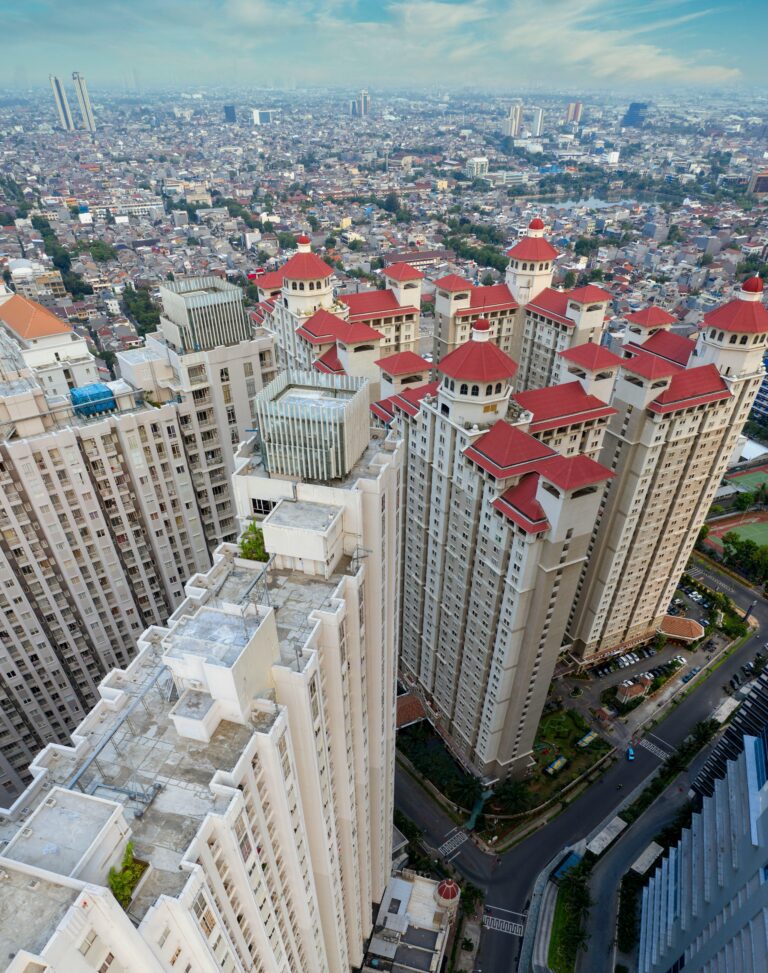 Aerial view of modern high-rise buildings in Jakarta, Indonesia, showcasing urban architecture.